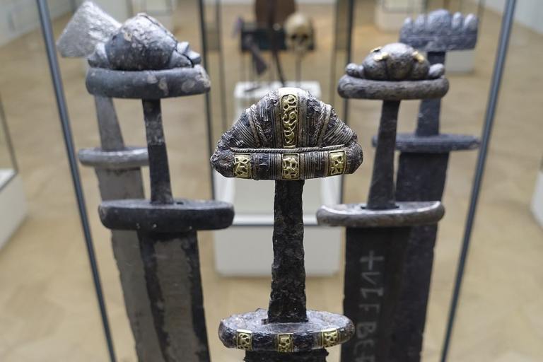 A museum collection of Viking weapons, featuring Viking swords