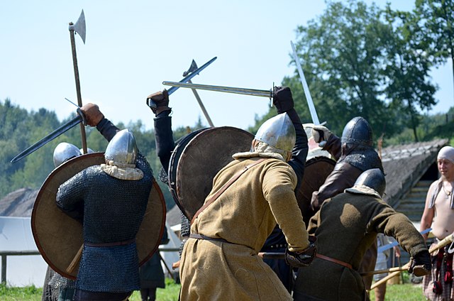 Reenactment of Viking warriors in battle. 